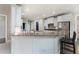 Kitchen featuring granite countertops and stainless steel appliances with bar seating at 183 Applewood Ln, Acworth, GA 30101