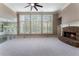 Bright living room with large windows, fireplace, and neutral carpet at 183 Applewood Ln, Acworth, GA 30101
