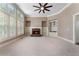 Neutral living room with fireplace, built-in shelving, and natural light at 183 Applewood Ln, Acworth, GA 30101