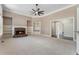 Spacious living room with fireplace, built-in shelving, and neutral color palette at 183 Applewood Ln, Acworth, GA 30101