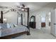 The primary bedroom has a canopy bed and access to the main bathroom and other rooms at 183 Applewood Ln, Acworth, GA 30101