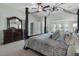 The primary bedroom features a wooden dresser with a large mirror and a comfortable canopy bed at 183 Applewood Ln, Acworth, GA 30101