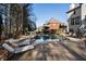 Inviting backyard pool with mature trees surrounding and cozy chaise lounges at 183 Applewood Ln, Acworth, GA 30101