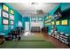 Recreation area with golf simulator, a seating area and storage for shoes and bags at 183 Applewood Ln, Acworth, GA 30101