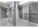 Large walk-in closet with custom built-in shelving, hanging rods, and full length mirror at 183 Applewood Ln, Acworth, GA 30101