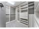 Spacious walk-in closet features custom shelving, drawers, and ample storage space for organization at 183 Applewood Ln, Acworth, GA 30101