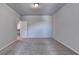 Large empty carpeted bedroom with light walls and a door leading to the hallway at 3353 Pearl Ridge Way, Buford, GA 30519