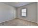 Bedroom features neutral carpeting, light gray walls, a window, and a closet at 3353 Pearl Ridge Way, Buford, GA 30519
