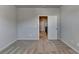 Bedroom boasts neutral carpet, light gray walls and a door to the hallway at 3353 Pearl Ridge Way, Buford, GA 30519