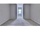 An empty bedroom with neutral walls and carpets, and a bright window view at 3353 Pearl Ridge Way, Buford, GA 30519