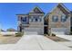Charming townhome with a two-car garage, neutral brick, and manicured landscaping at 3353 Pearl Ridge Way, Buford, GA 30519