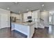 Modern kitchen with stainless steel appliances, granite countertops, an island, and hardwood floors at 3353 Pearl Ridge Way, Buford, GA 30519