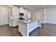 Stylish kitchen with granite countertops, stainless steel appliances, an island, and hardwood floors at 3353 Pearl Ridge Way, Buford, GA 30519