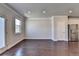 Spacious living room featuring hardwood floors, a large window and recessed lighting at 3353 Pearl Ridge Way, Buford, GA 30519