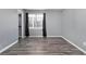 Spacious bedroom with gray walls, window, and wood-look flooring at 115 Hol Mar Trl, Mcdonough, GA 30253