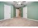 Bedroom with green walls and double door closets at 262 Senna St, Marietta, GA 30064