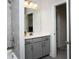 Modern bathroom with gray vanity and tile at 768 Marlay Ln, Powder Springs, GA 30127