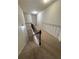 Upstairs hallway with carpet and a staircase leading down at 15 Manas Ct, Covington, GA 30016