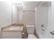 Bathroom with single vanity and bathtub at 241 Rockingham Dr, Loganville, GA 30052