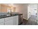 Kitchen with granite countertops, stainless steel appliances, and a view of the living room at 241 Rockingham Dr, Loganville, GA 30052