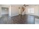 Spacious living area with hardwood floors and access to stairs at 241 Rockingham Dr, Loganville, GA 30052