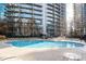 Resort-style pool with plenty of lounge chairs at 44 Peachtree Ne Pl # 1128, Atlanta, GA 30309