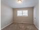 Cozy bedroom with neutral carpeting and a large window at 530 Balfour Dr, Decatur, GA 30032