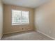 Simple bedroom with neutral walls, carpeting, and a large window at 530 Balfour Dr, Decatur, GA 30032