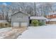 Gray house with a two-car garage and snowy front yard at 530 Balfour Dr, Decatur, GA 30032
