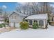 Gray house with a two-car garage and snowy front yard at 530 Balfour Dr, Decatur, GA 30032