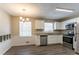Bright kitchen with white cabinets, granite counters, and stainless steel appliances at 530 Balfour Dr, Decatur, GA 30032