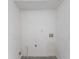 Small laundry room with plumbing and electrical hookups at 530 Balfour Dr, Decatur, GA 30032