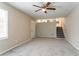 Living room with stairs and ceiling fan at 530 Balfour Dr, Decatur, GA 30032
