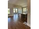 Open concept kitchen with an island and hardwood floors at 1609 Tielman Way, Snellville, GA 30078