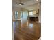 Open living area with hardwood floors, kitchen island, and abundant natural light at 1609 Tielman Way, Snellville, GA 30078