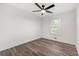 Bright bedroom with ceiling fan and hardwood-style flooring at 2139 Logan Dr, Jonesboro, GA 30236