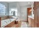 Bathroom with bathtub, decorative tile, window and double sink vanity at 3204 Woodrow Ne Way, Atlanta, GA 30319
