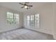 Bedroom with large windows and carpet at 3204 Woodrow Ne Way, Atlanta, GA 30319