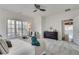 Bedroom with carpet, ceiling fan, dresser and large windows at 3204 Woodrow Ne Way, Atlanta, GA 30319