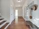 Hallway with hardwood floors, bench, and storage shelves at 3204 Woodrow Ne Way, Atlanta, GA 30319