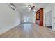 Living room features hardwood floors, a ceiling fan, and custom built-in shelves at 3204 Woodrow Ne Way, Atlanta, GA 30319
