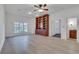 Living room features hardwood floors, a ceiling fan, and custom built-in shelves at 3204 Woodrow Ne Way, Atlanta, GA 30319