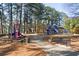 Community playground features a slide, swings, benches, and open spaces at 3204 Woodrow Ne Way, Atlanta, GA 30319