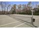 Enjoy a game of tennis on this well-maintained court, surrounded by mature trees and lush landscaping at 3204 Woodrow Ne Way, Atlanta, GA 30319
