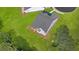 Aerial view of a house with gray roof and green lawn at 3709 Tielman St, Snellville, GA 30078