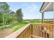 Scenic view from the back porch overlooking the lush green golf course on a sunny day at 3709 Tielman St, Snellville, GA 30078