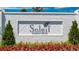 Close up of the Soleil Summit Chase community sign with manicured flower beds and greenery in front of the sign at 3709 Tielman St, Snellville, GA 30078