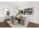 Formal dining room featuring modern lighting fixture, art and seating for six at 3709 Tielman St, Snellville, GA 30078