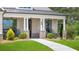 Attractive two-story home with a lush green lawn and a welcoming front porch with seating at 3709 Tielman St, Snellville, GA 30078