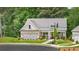 Charming new home with a landscaped yard, an attached garage, and a welcoming front porch at 3709 Tielman St, Snellville, GA 30078
